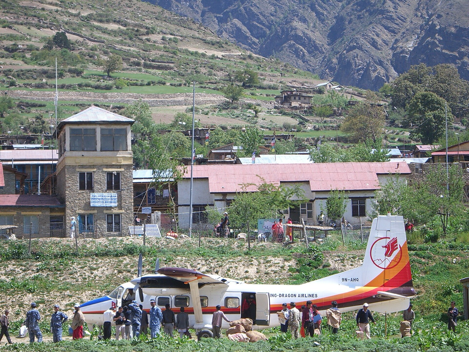 A Flying Dragon Airlines Harbin Y-12 twin-engine aircraft parked at Simikot Airport