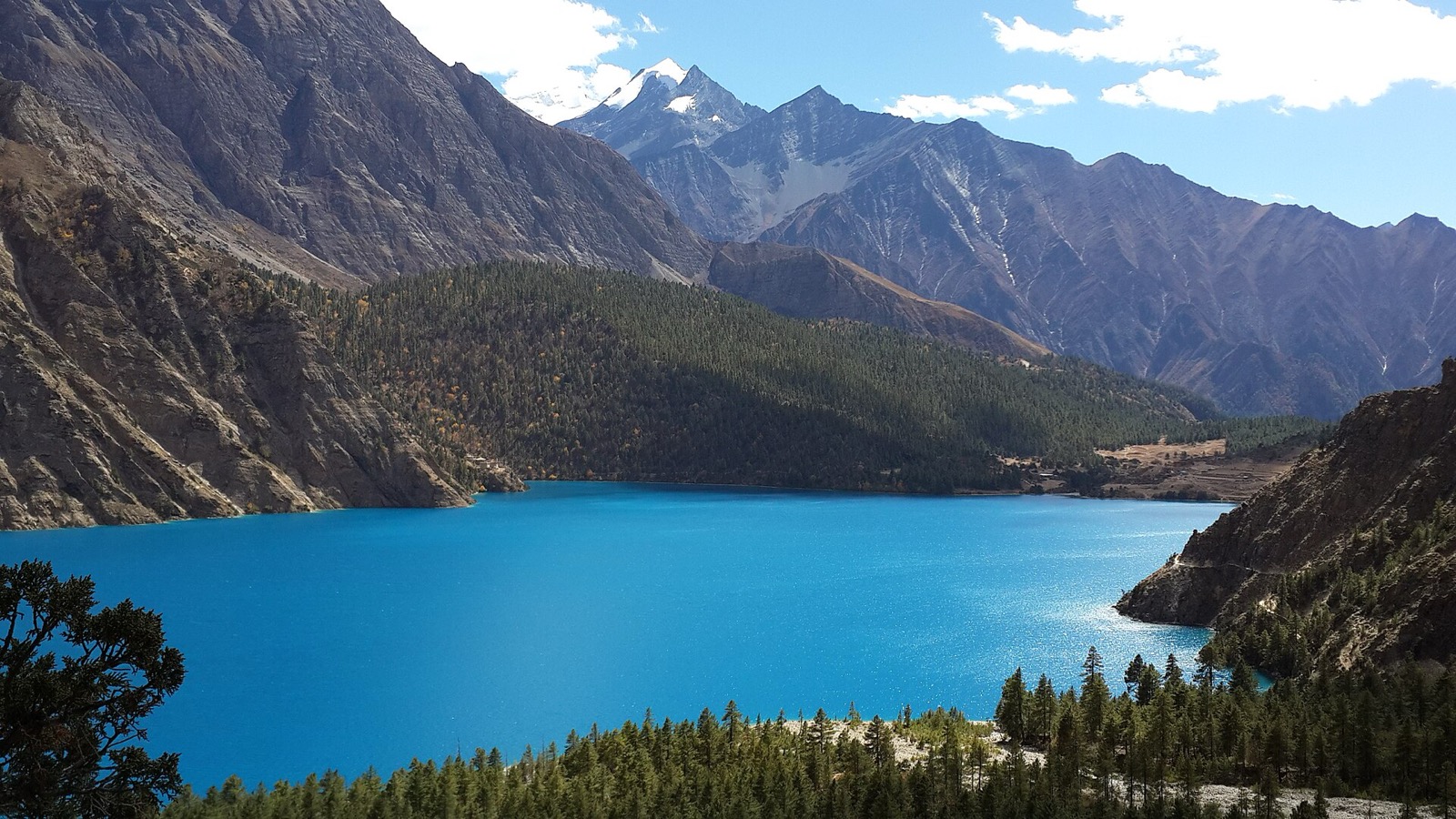 Turquoise Shey Phoksundo Lake in Dolpa, surrounded by steep mountain slopes