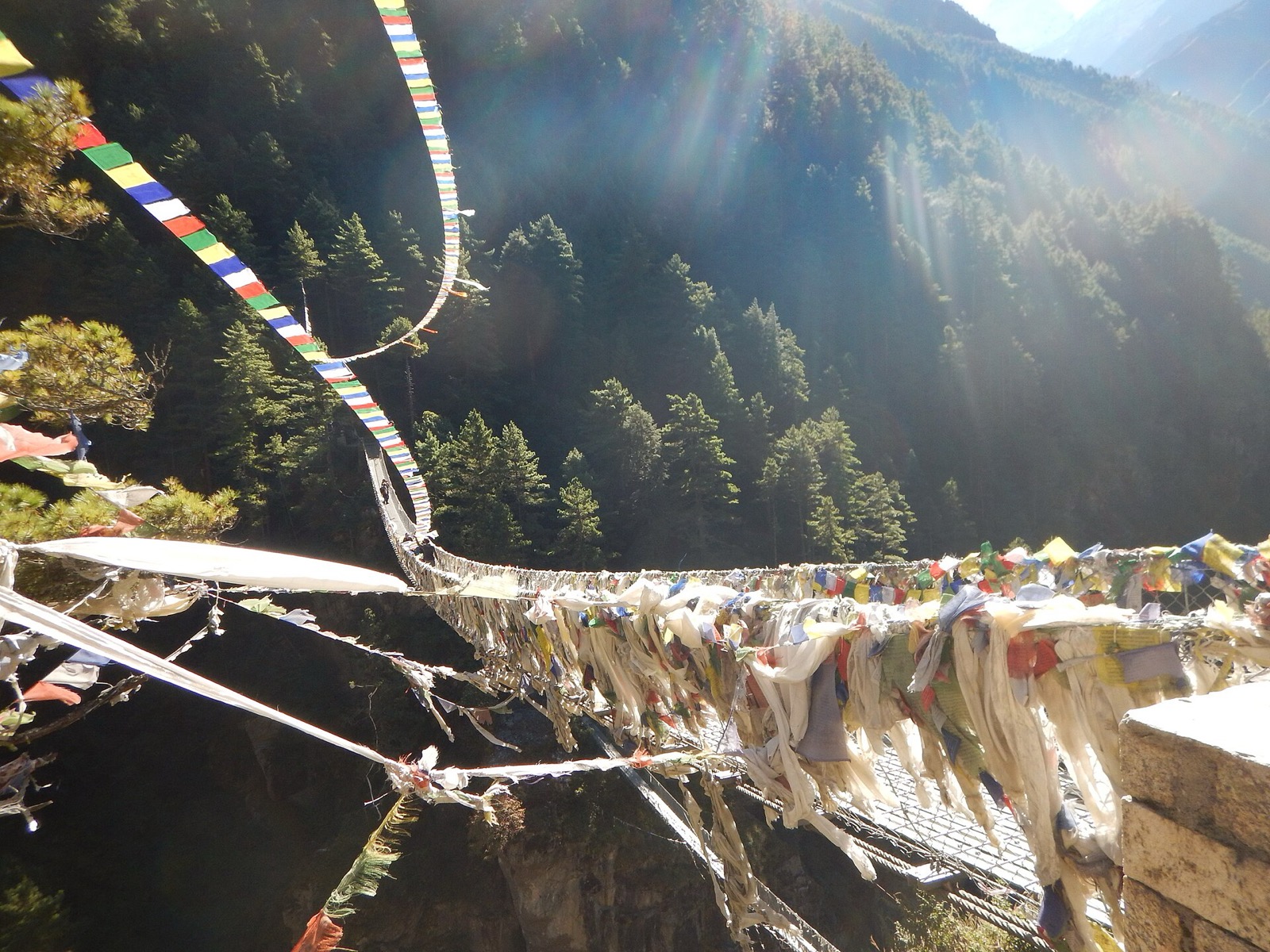 A suspension bridge spanning a river on the Lukla to Namche Bazaar trail in Nepal